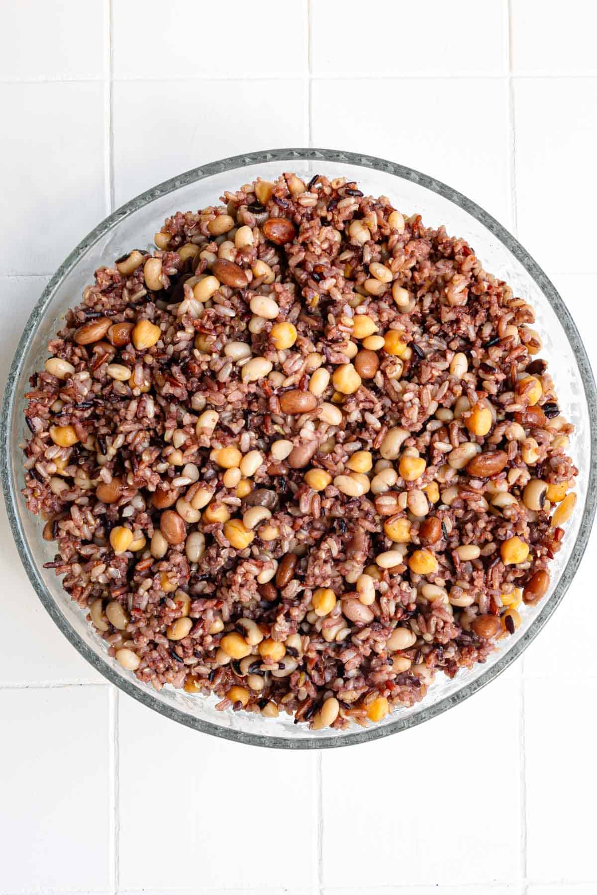 Cooked rice and beans in a large glass bowl.