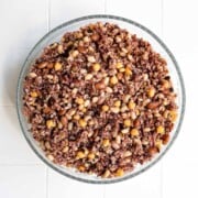 Cooked rice and beans in a large glass bowl.