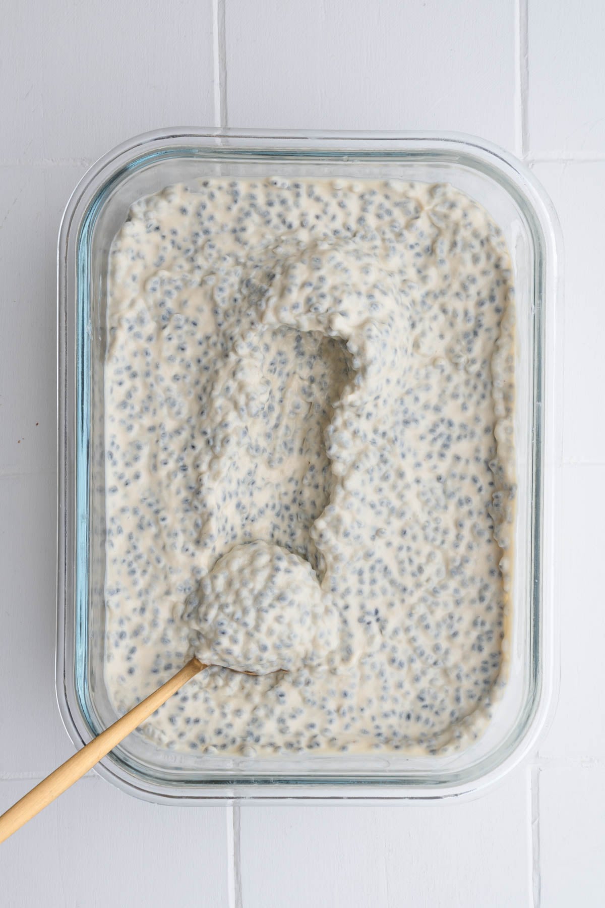 Savory chia pudding in a meal prep container.