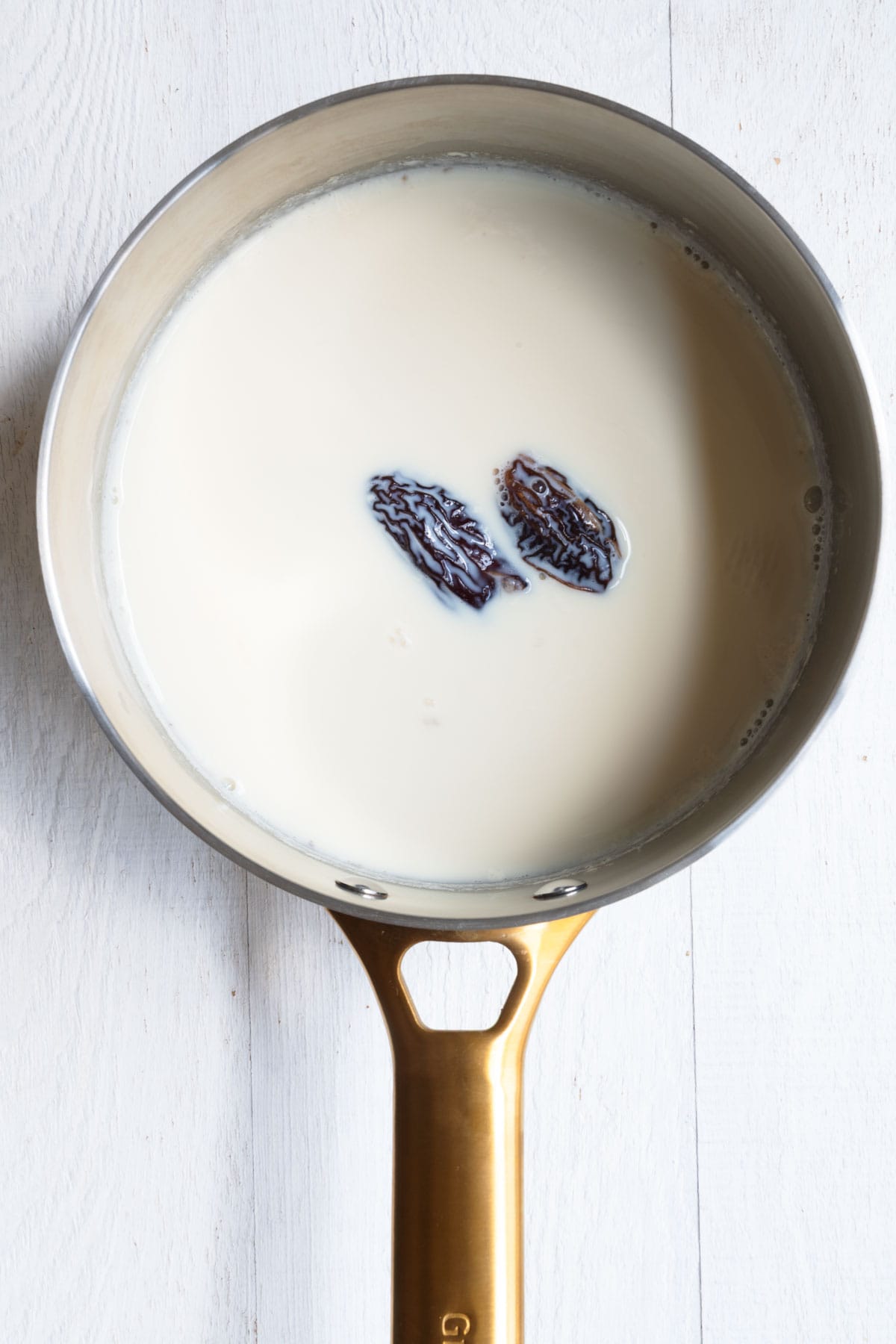Dates soaking in warm nondairy milk.
