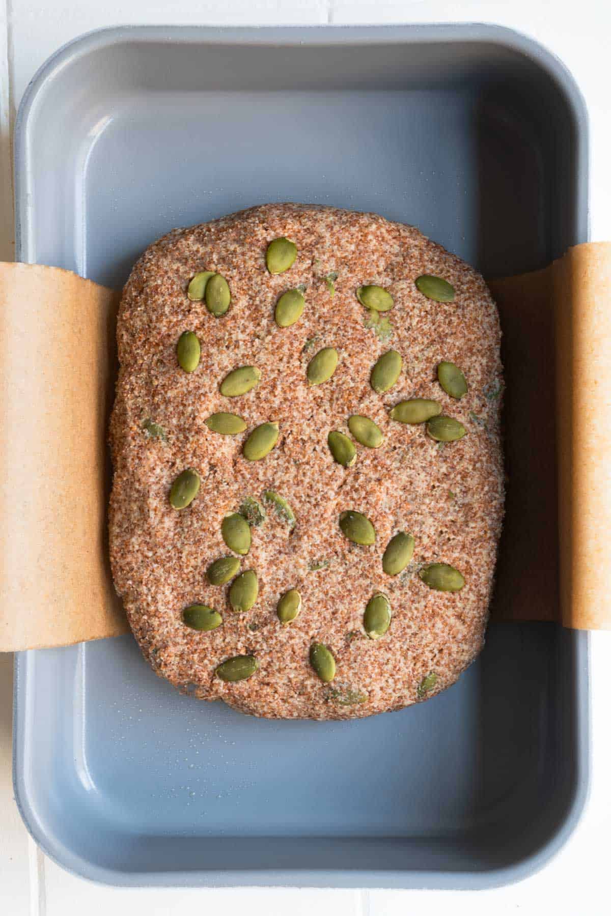 Shaped dough in a baking pan.