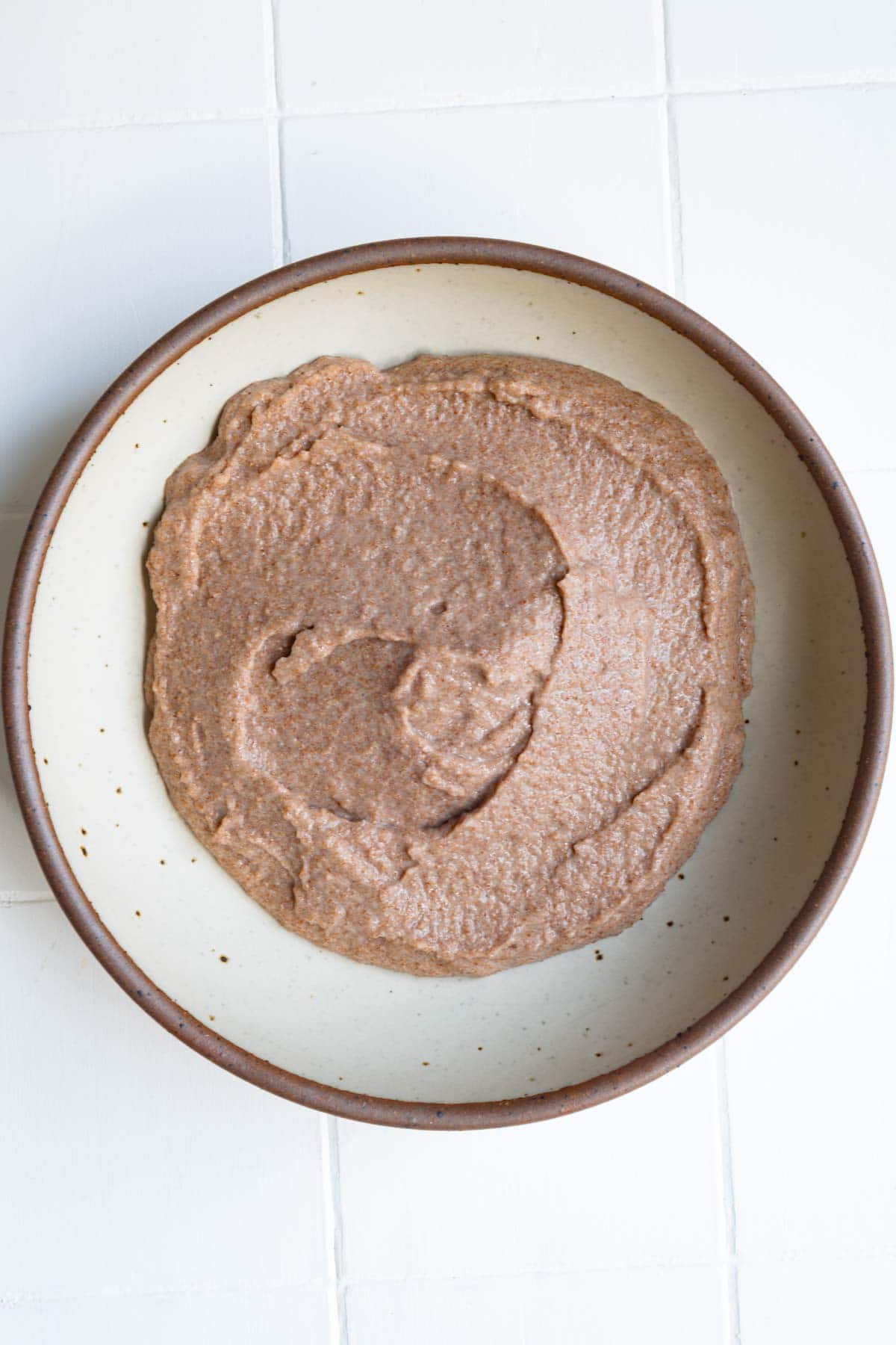 Creamy cooked and blended teff in a bowl.
