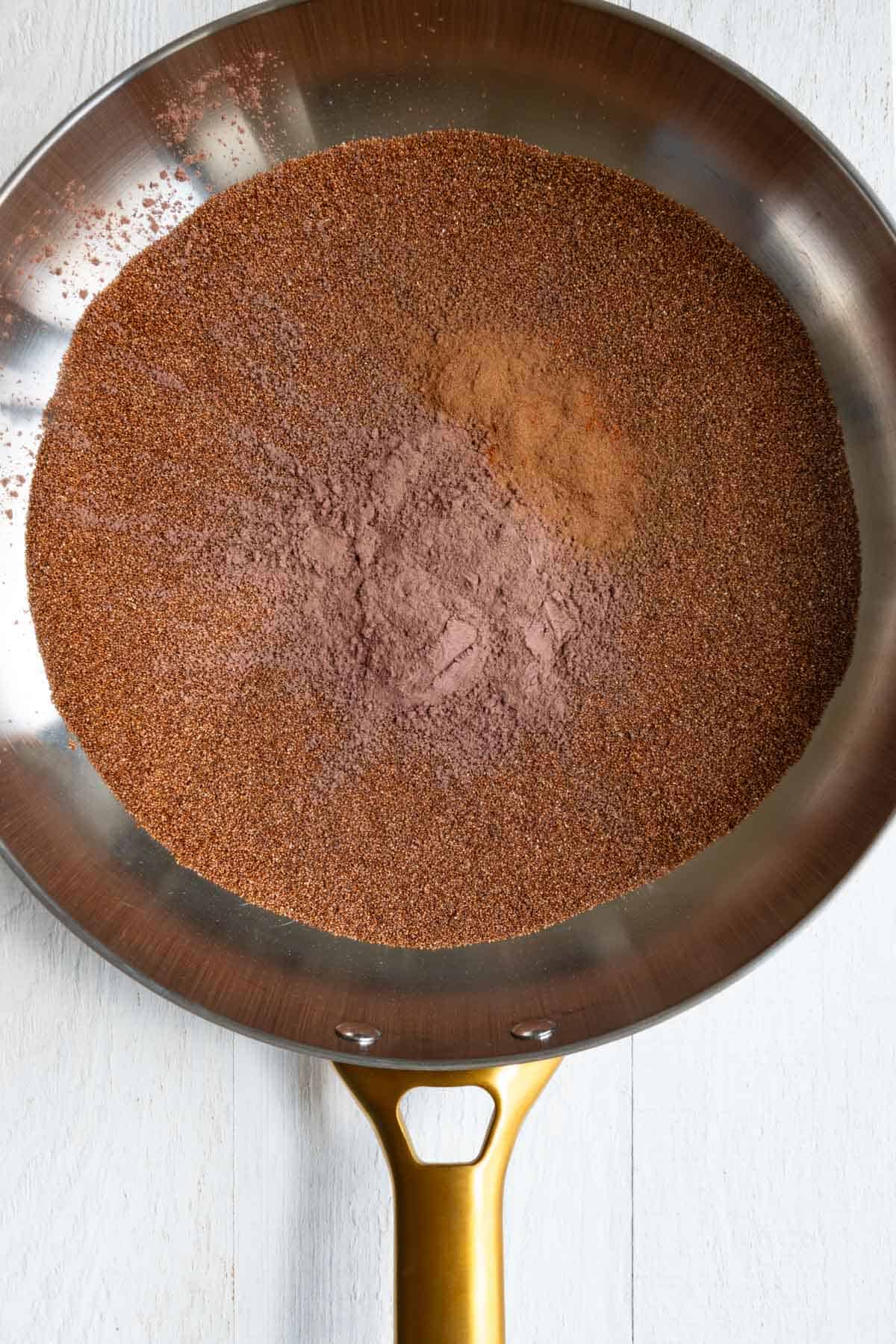 Toasted teff, cinnamon, and cayenne in a large skillet.