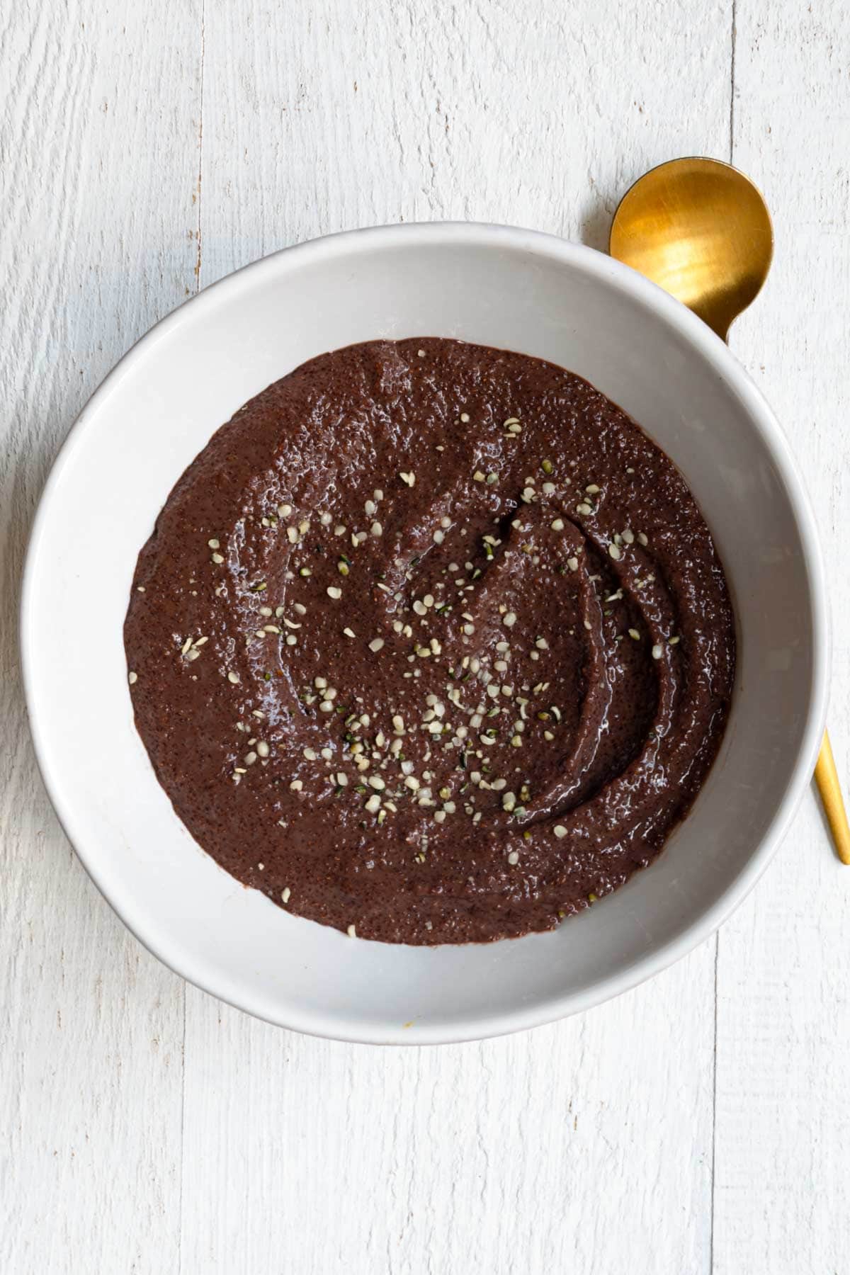 Chocolate Teff Porridge in a white bowl.