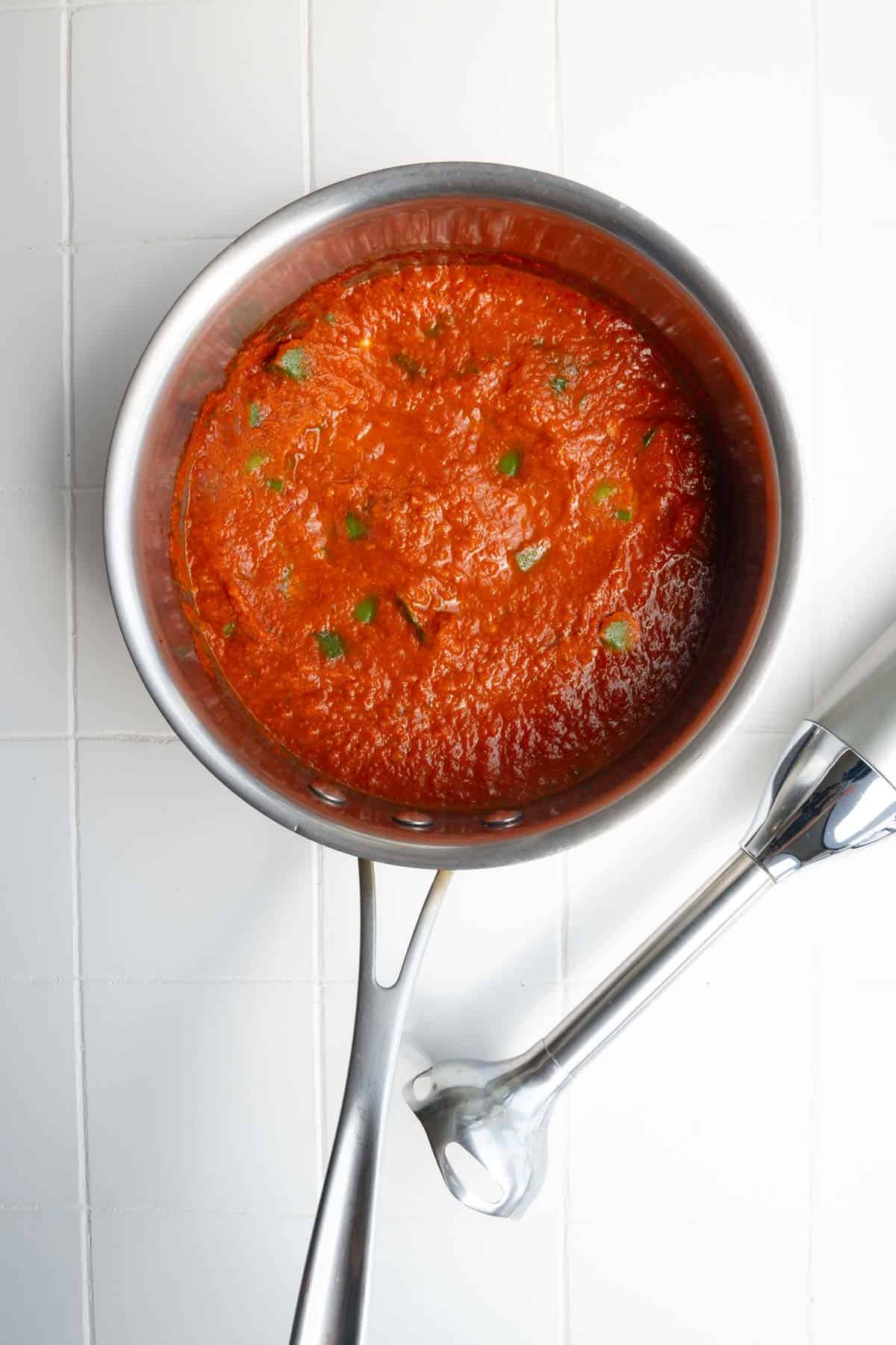 Okra in tomato sauce in a saucepan.
