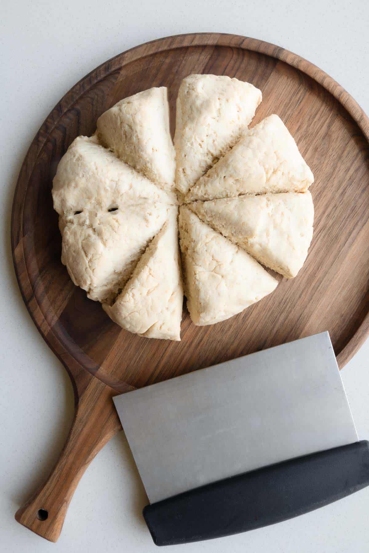 Dough divides into eight equal parts on a cutting board.