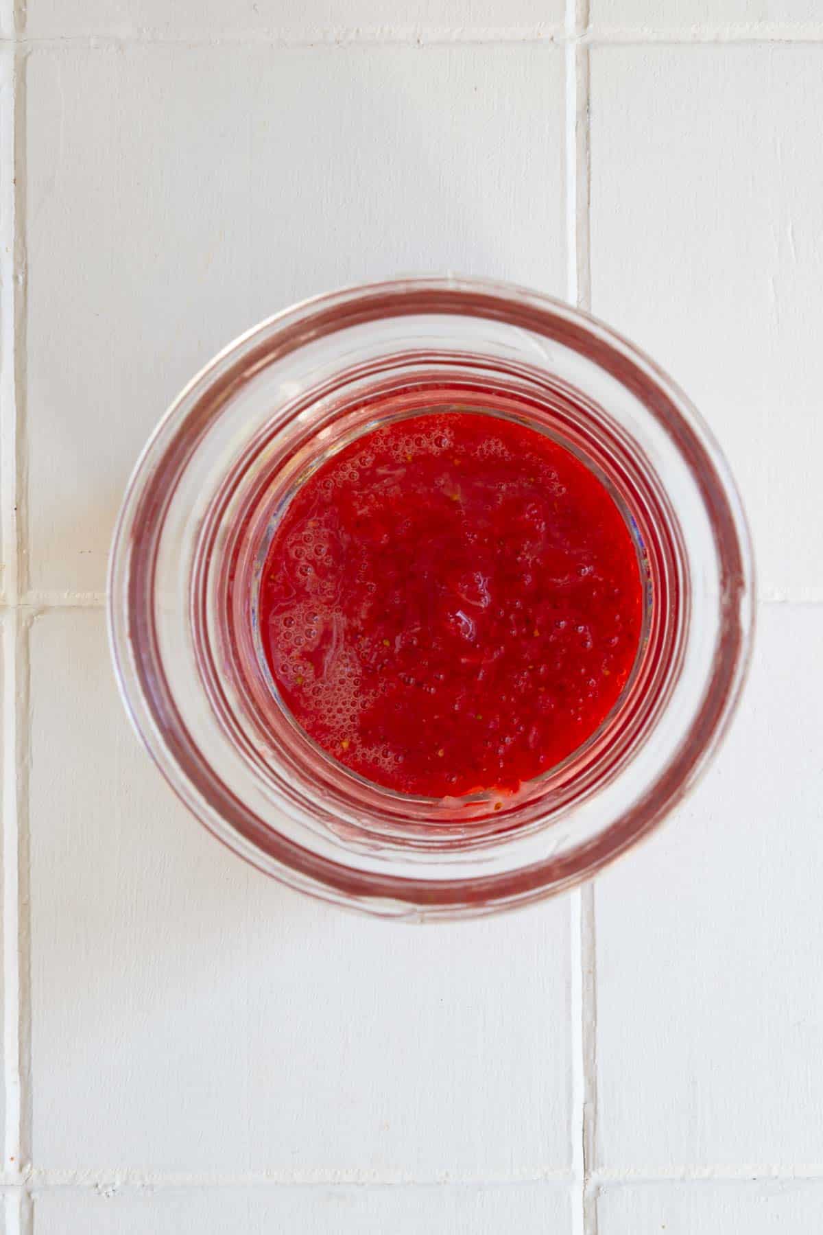 Strawberry puree in a glass.