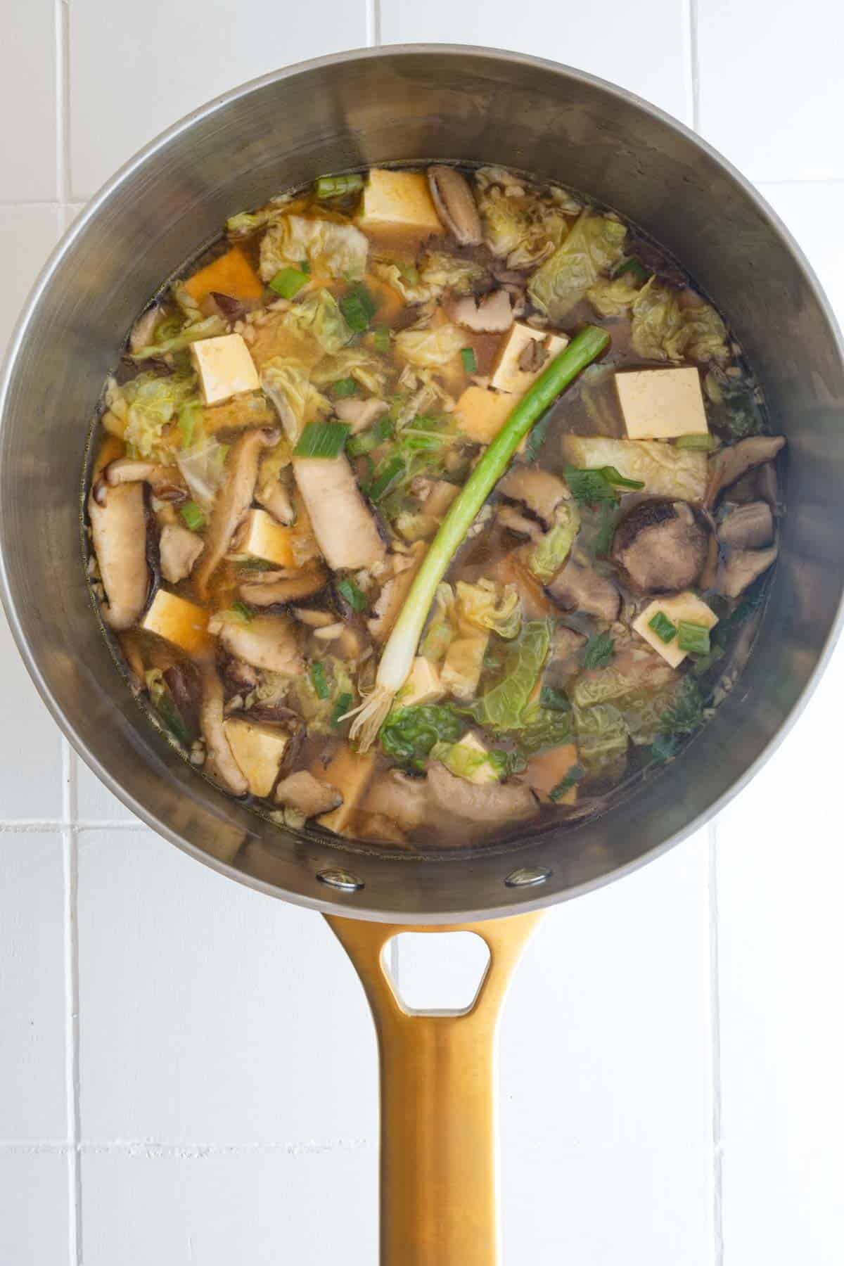 Mushroom tofu soup in a saucepan.