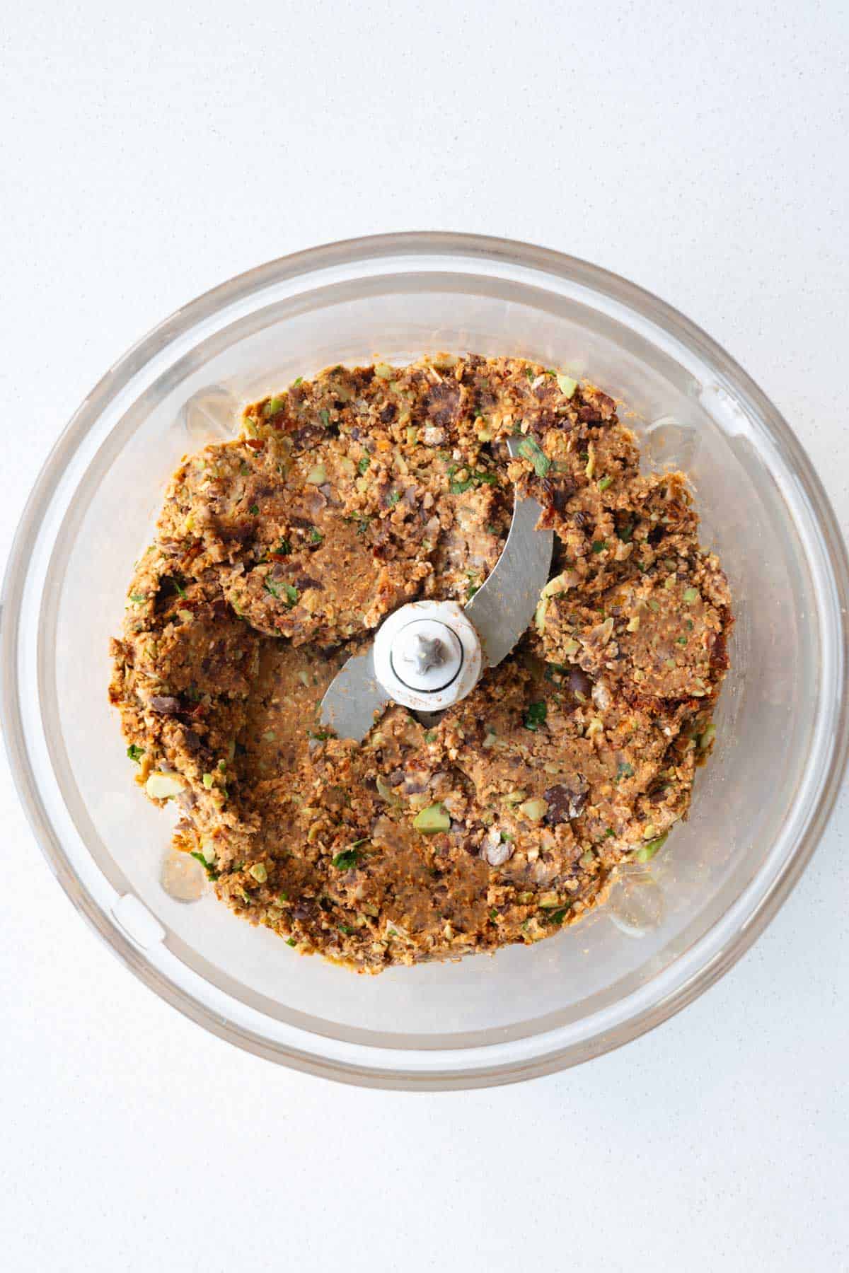 Processed ingredients for veggie patties in a food processor.