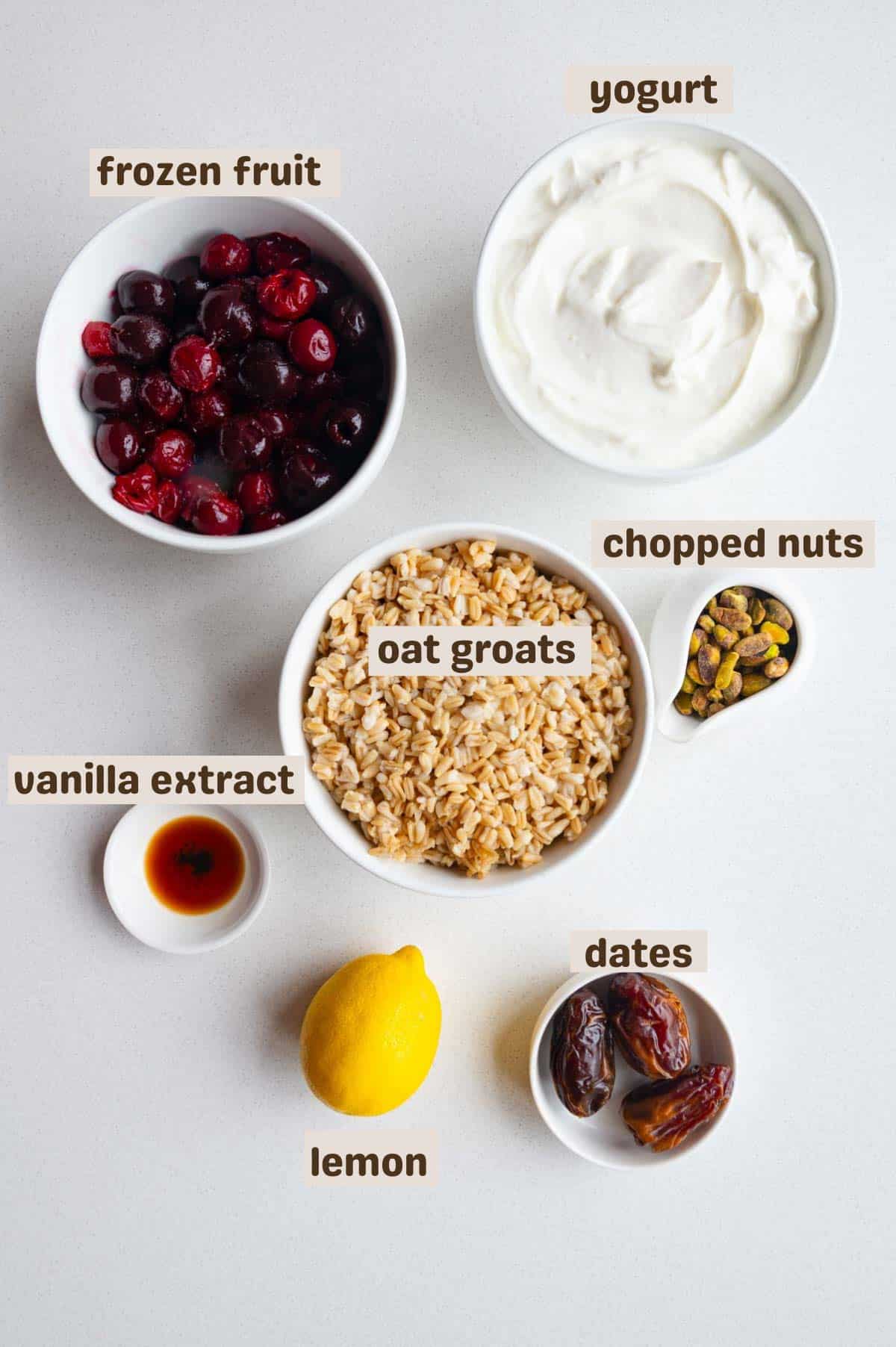 Frozen fruit, yogurt, oat groats, pistachios, vanilla extract, and dates.