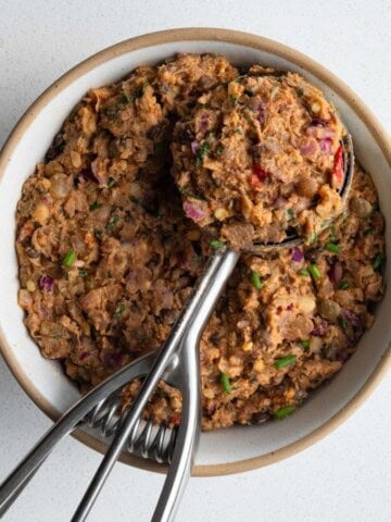 Pinto bean smash in a bow/ with an ice cream scoop.