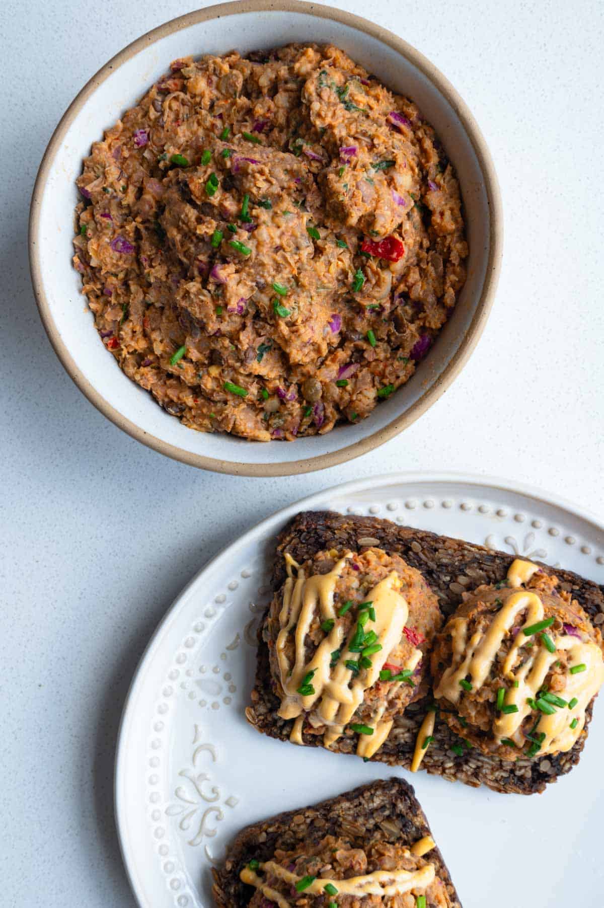 Pinto bean smash in a bow/ with an ice cream scoop.