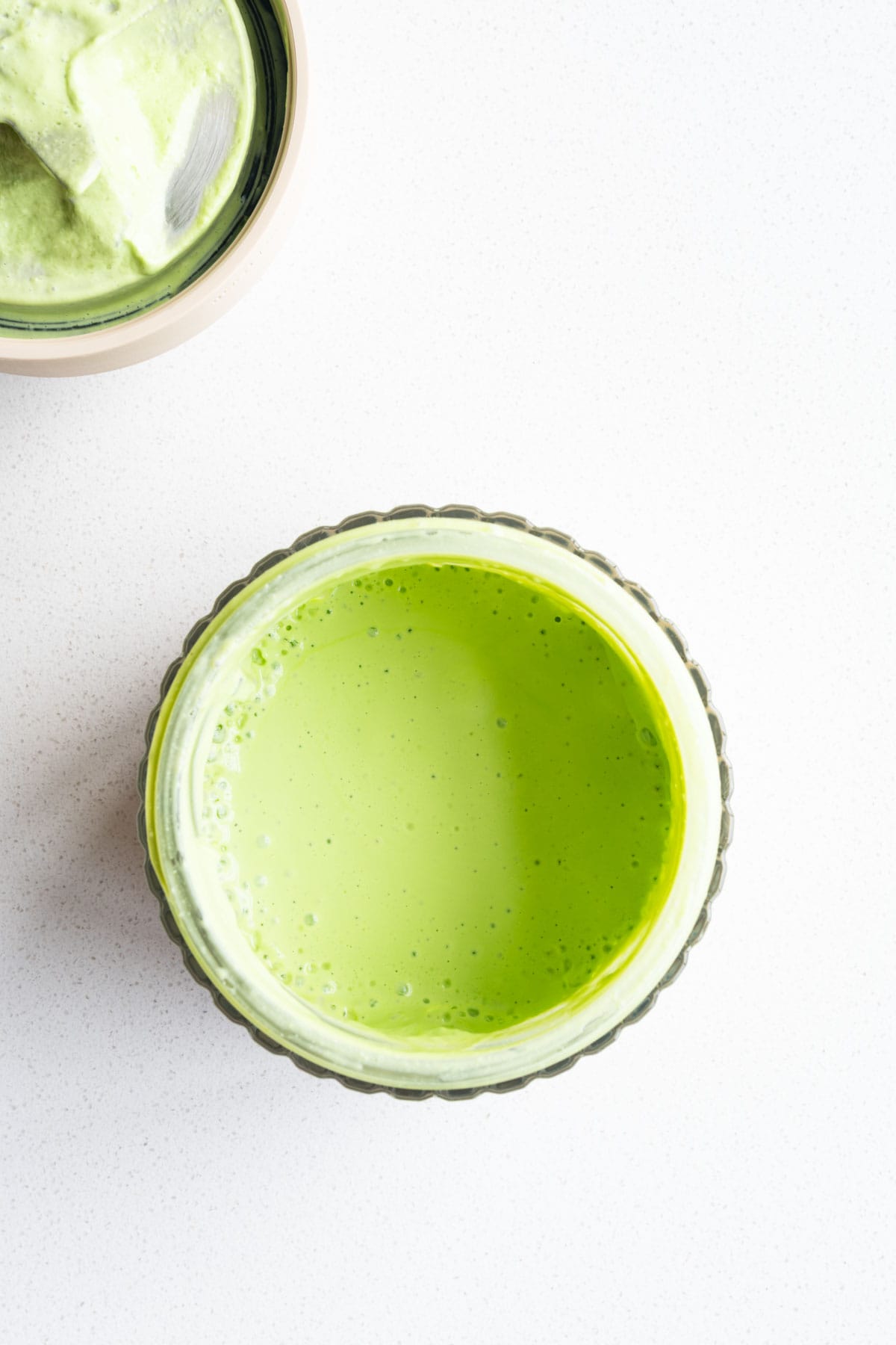Creamy green goddess no-mayo dressing in a blender.