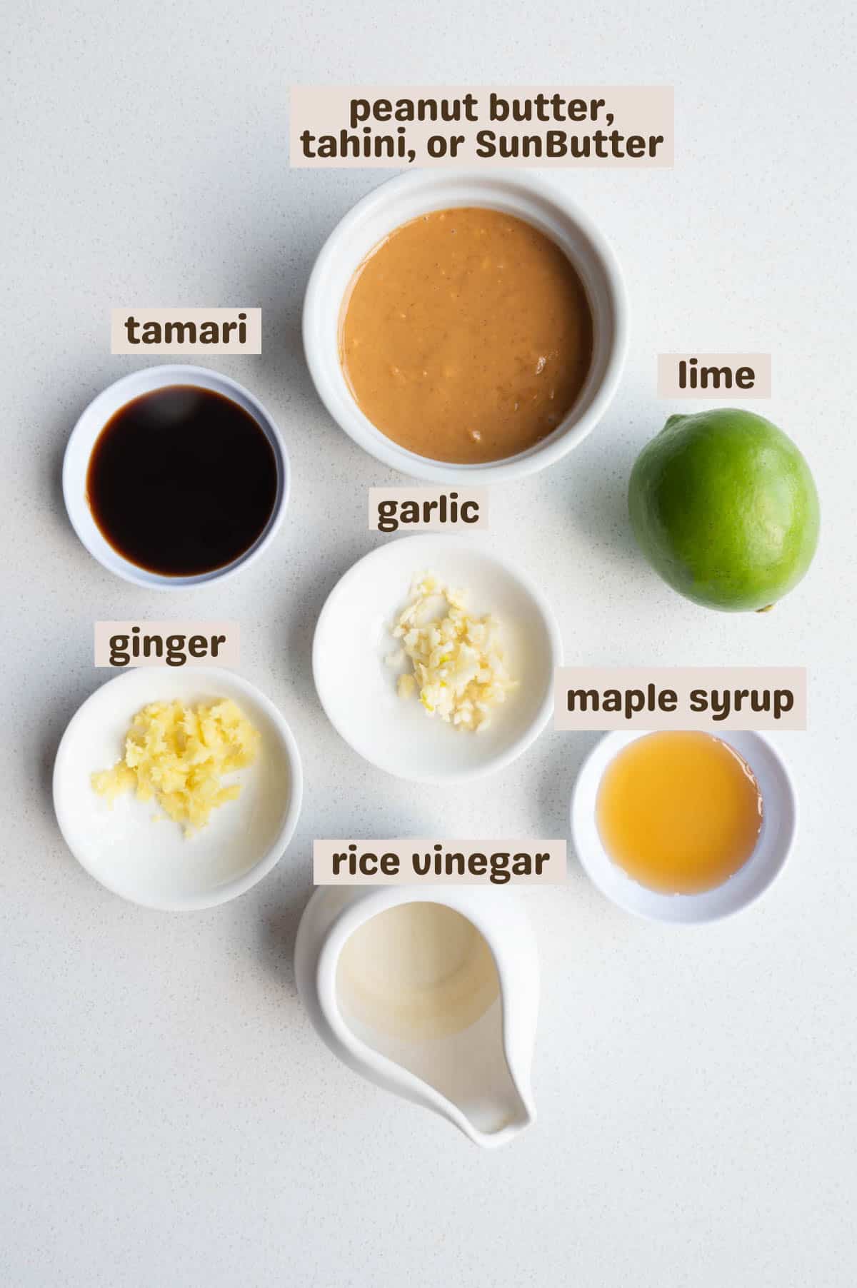 Peanut butter, tamari, lime, maple syrup, rice vinegar, ginger, and garlic.