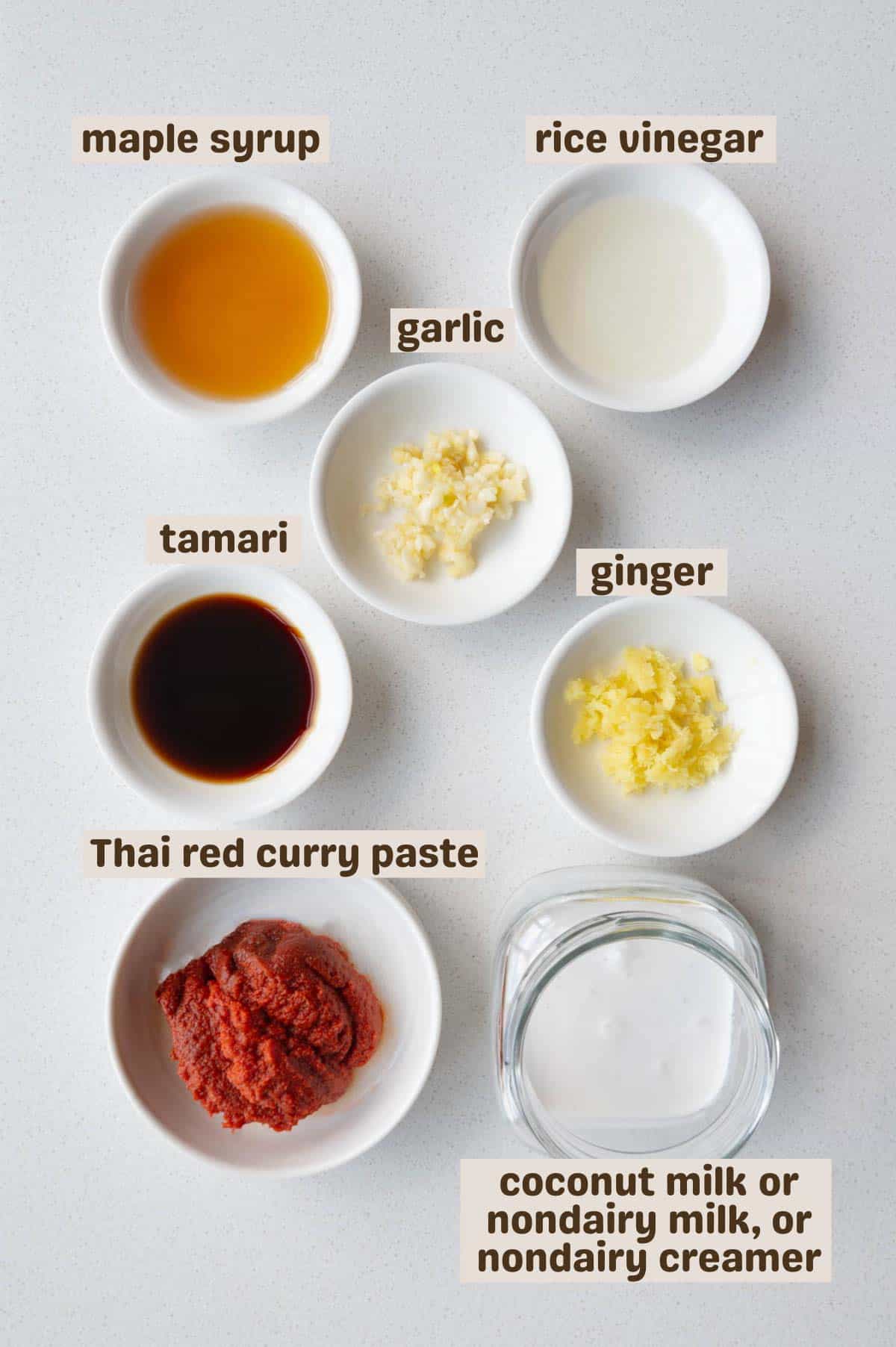 Maple syrup, rice vinegar, garlic, ginger, Thai red curry paste, coconut milk, and tamari.