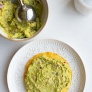 Creamy white bean mash on a tostada.