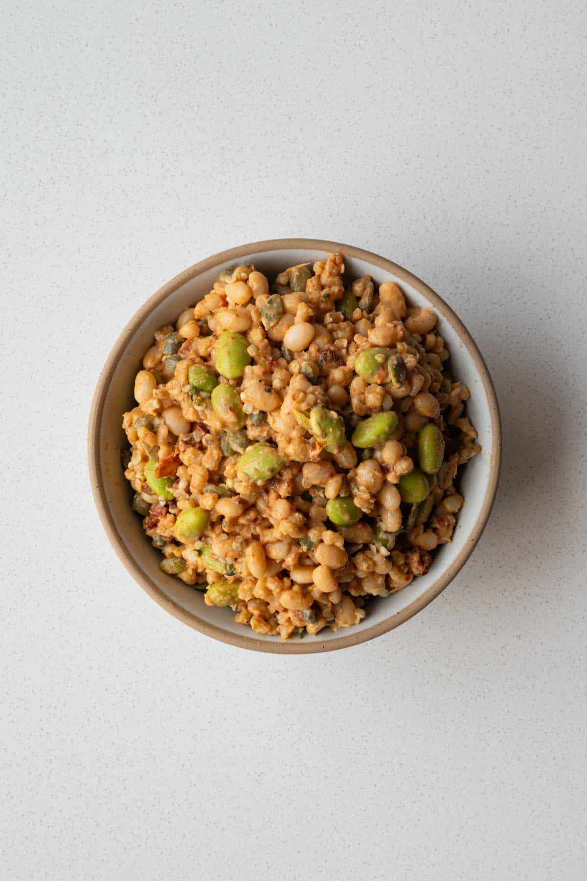 Creamy bean and barley salad in a bowl.