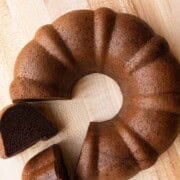 High-protein chocolate cake sliced on a cutting board. Vegan, flourless, and healthy.