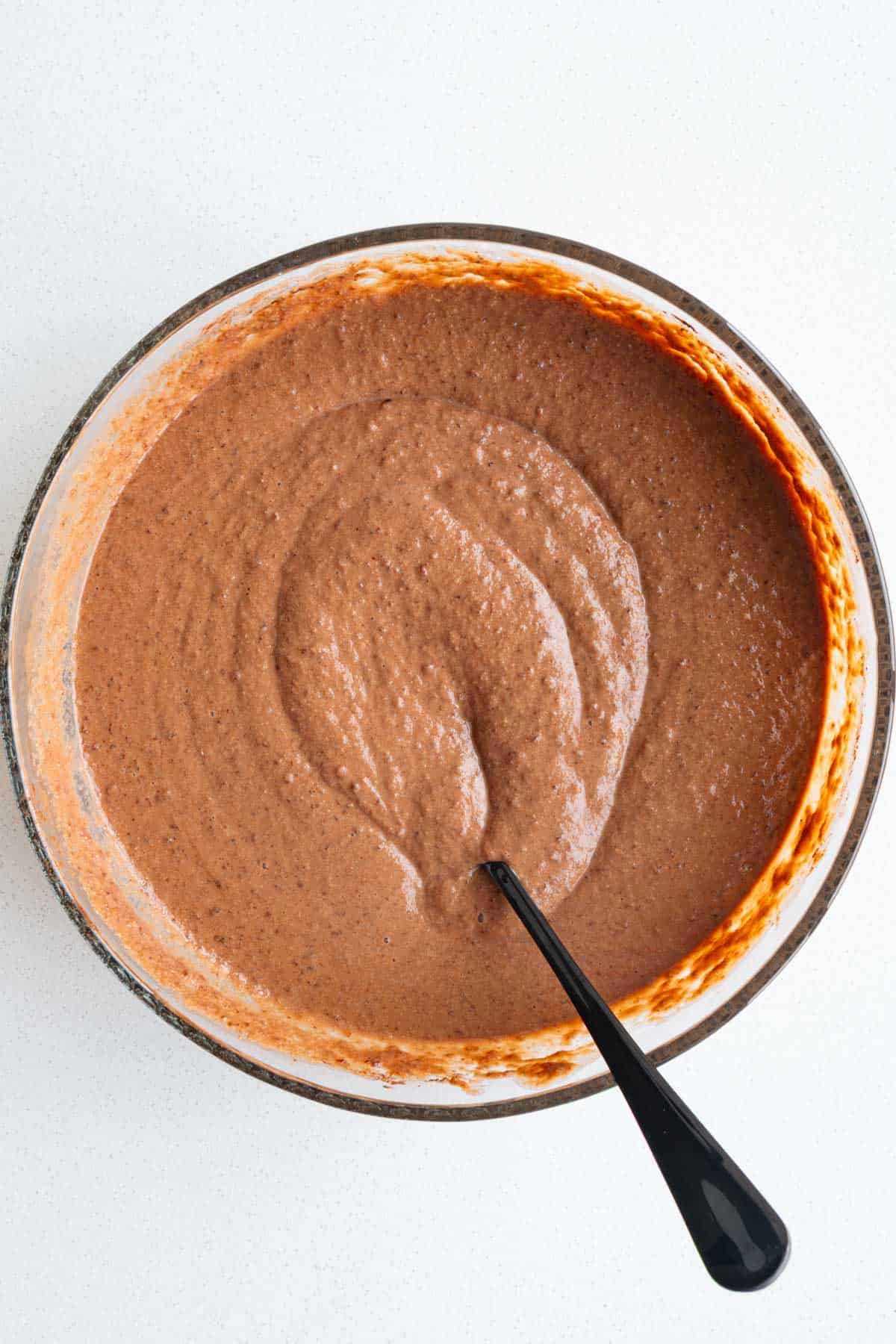 Chocolate cake batter in a bowl.