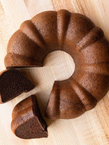 High-protein chocolate cake sliced on a cutting board. Vegan, flourless, and healthy.