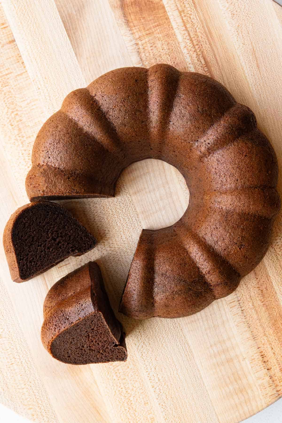 High-protein chocolate cake sliced on a cutting board. Vegan, flourless, and healthy.