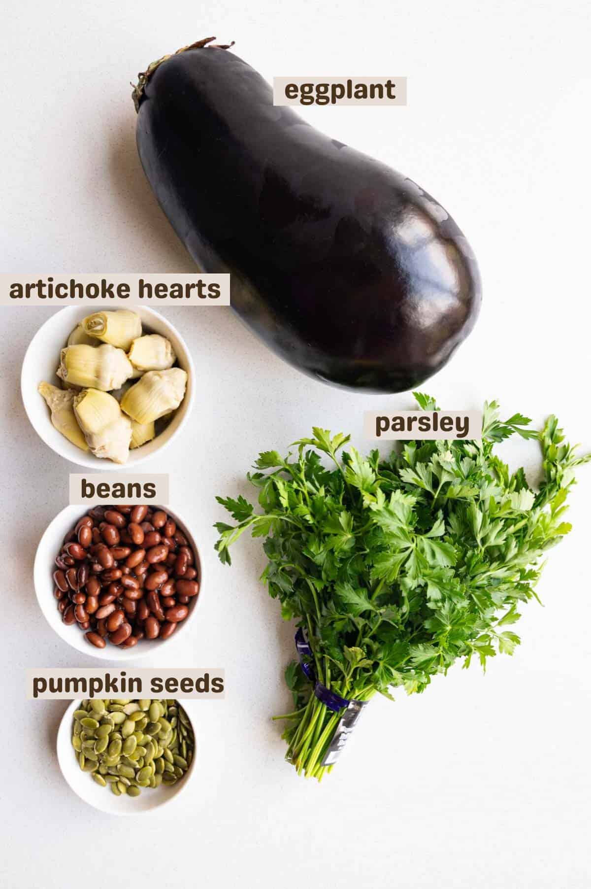 Eggplant, beans, artichoke hearts, pumpkin seeds, and parley.