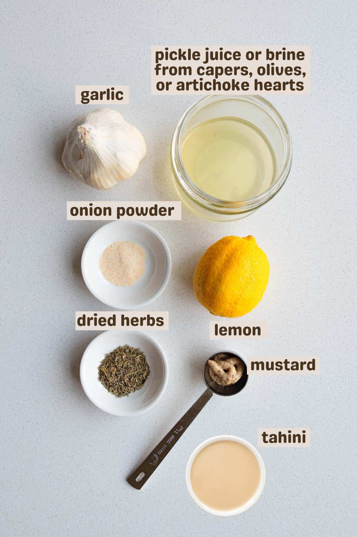 Pickle juice, tahini, lemon juice, garlic, mustard, miso, dried herbs, and onion powder.