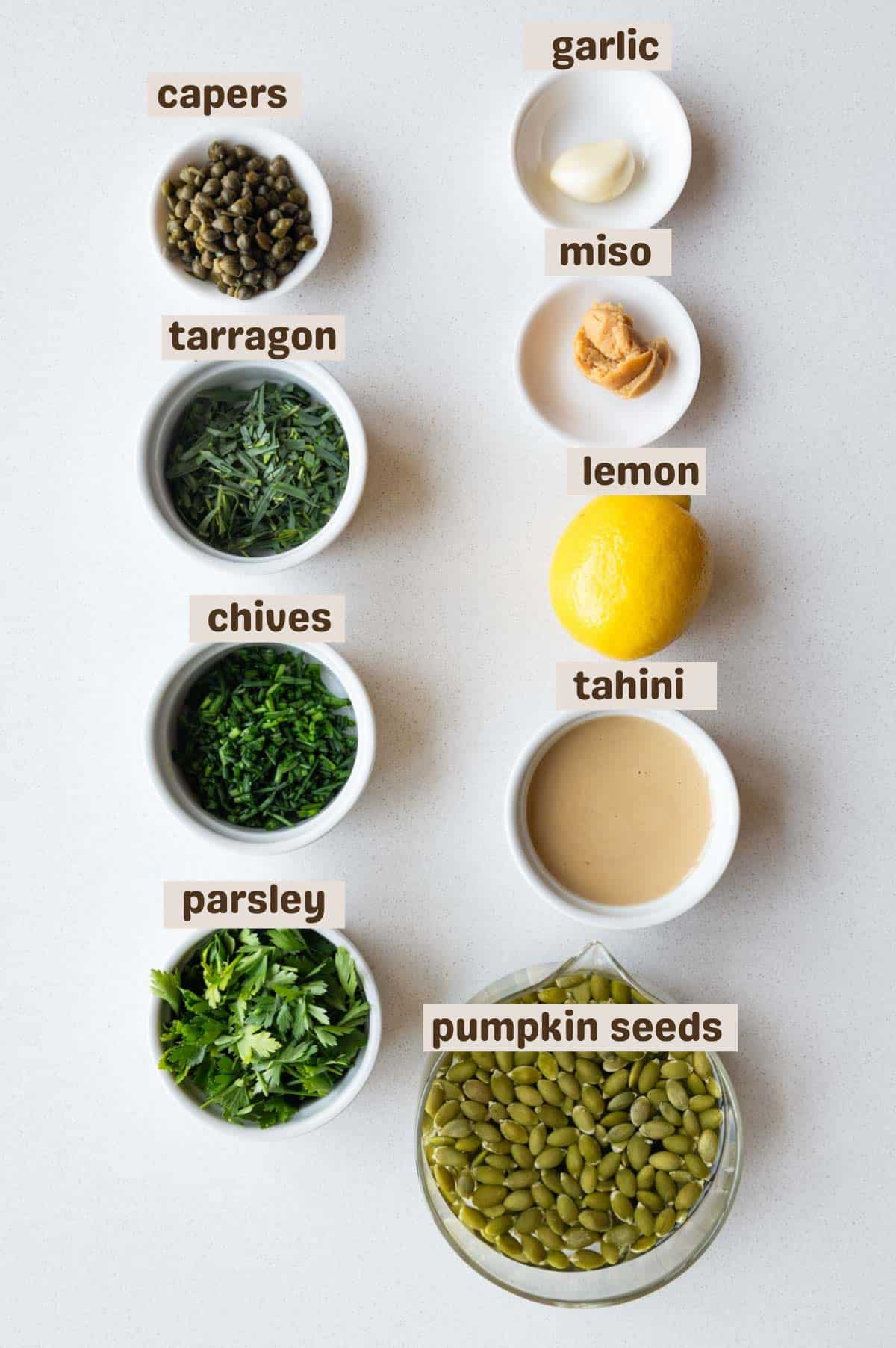 Capers, pumpkin seeds, tarragon, chives, parsley, miso, garlic, tahini, and lemon.