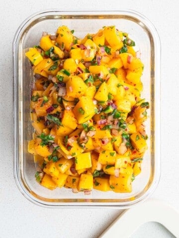 Fresh mango salsa in a glass dish.