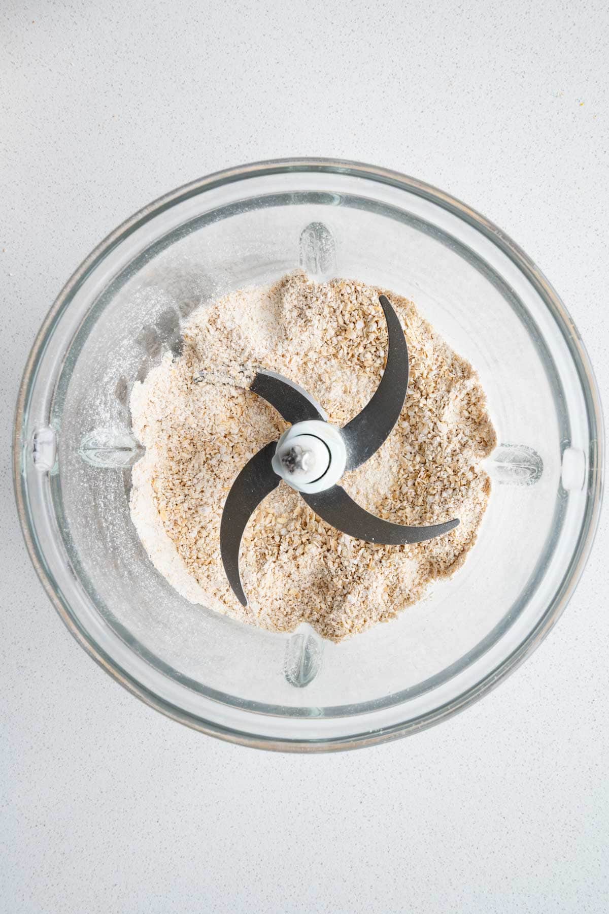 Ground rolled oats in a food processor.