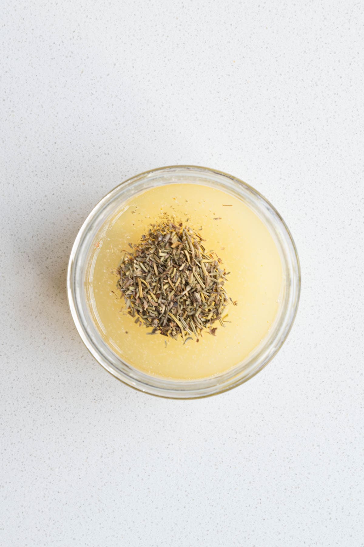 Pickle juice, lemon juice, garlic, mustard, miso, dried herbs, and onion powder in a jar