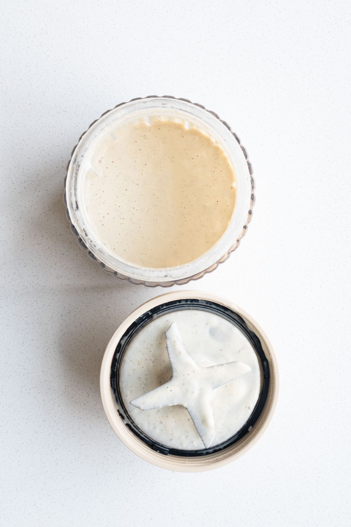 Creamy white dressing in a blender.