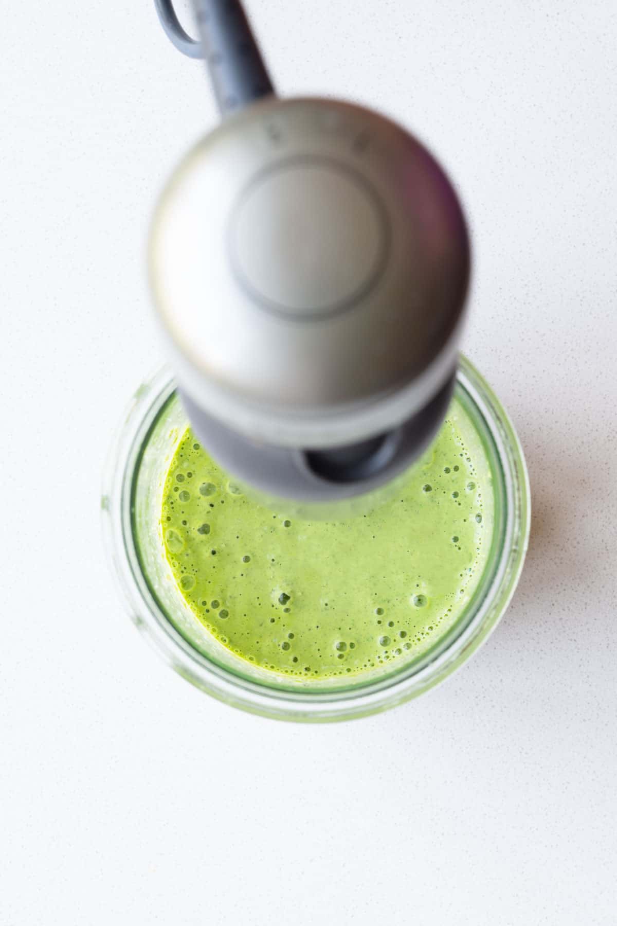 Blended creamy pumpkin seed dressing.