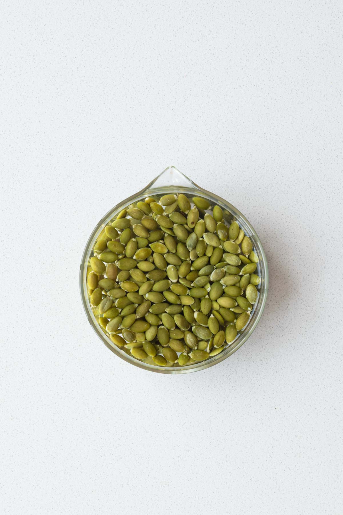 Pumpkin seeds soaking in water.