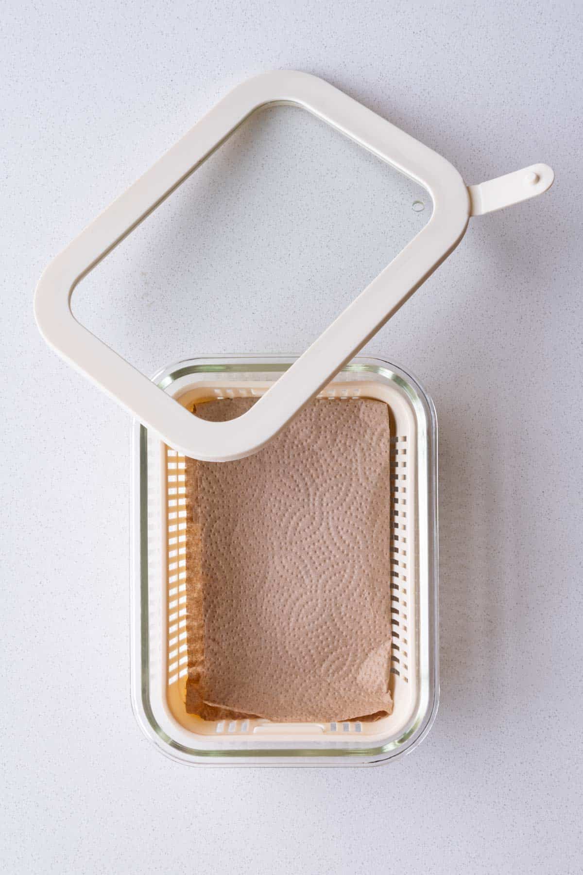 Glass container lined with unbleached paper towel.