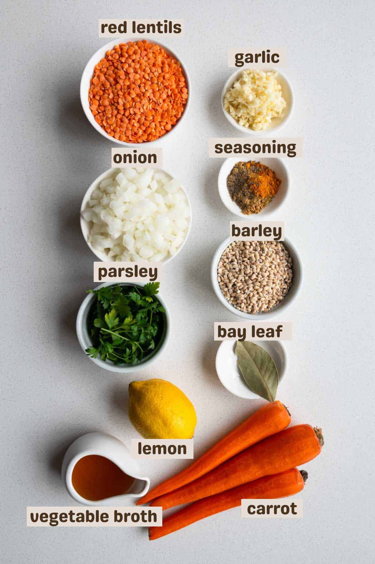 Dried split red lentils, minced garlic, chopped onion, seasoning, cilantro, bay leaf, carrots, lemon, and vegetable broth.