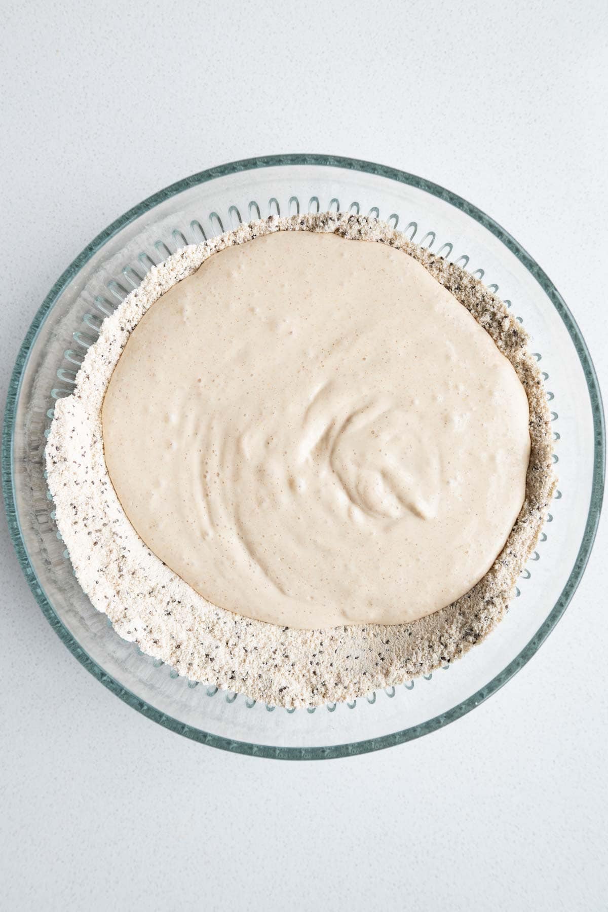 Dry ingredients mixed with the wet blended ingredients on top.