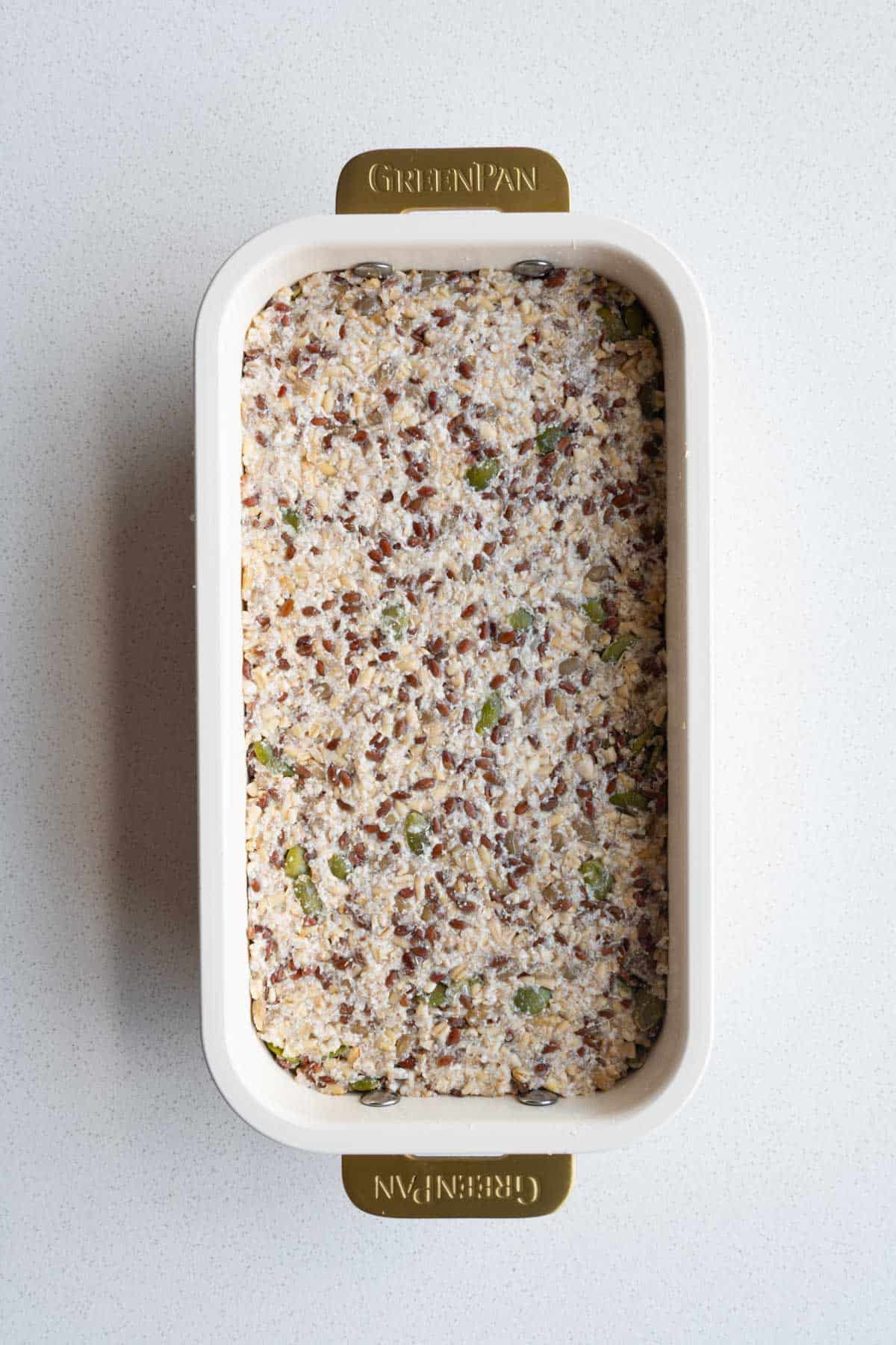 No yeast seed bread batter in a loaf pan.
