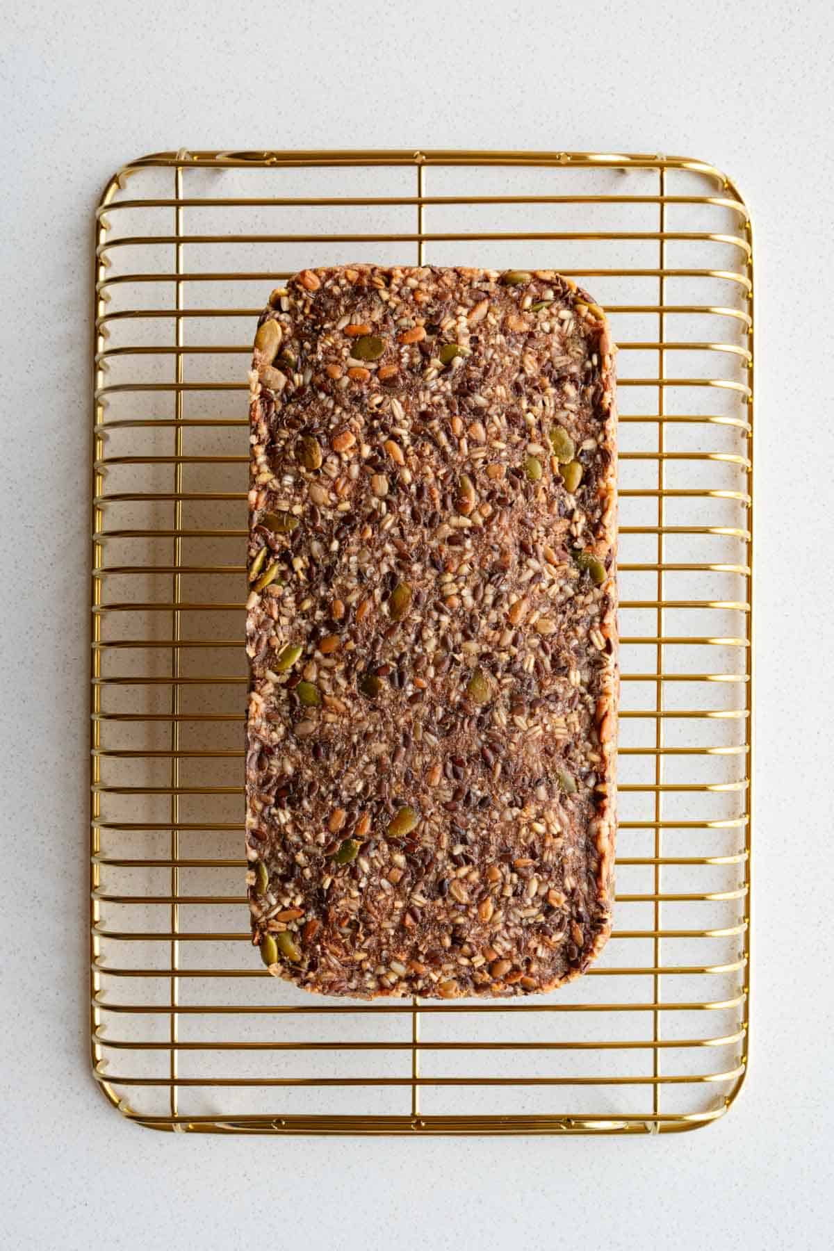 Gluten-free Porridge Bread (Seed Bread) made with no yeast on a cooling rack.