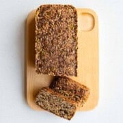 Gluten-free Porridge Bread (Seed Bread) made with no yeast sliced on a cutting board.