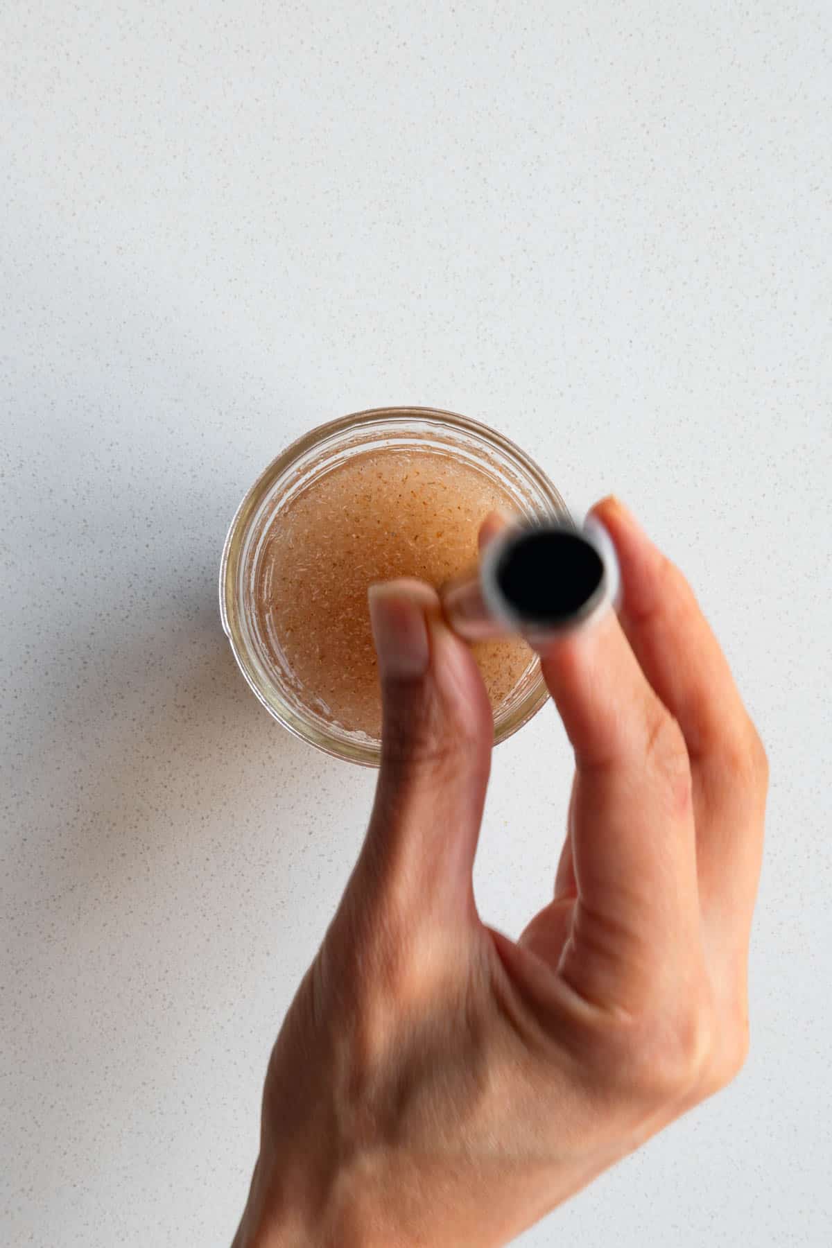 Hydrated psyllium husk in water in a glass with a straw.