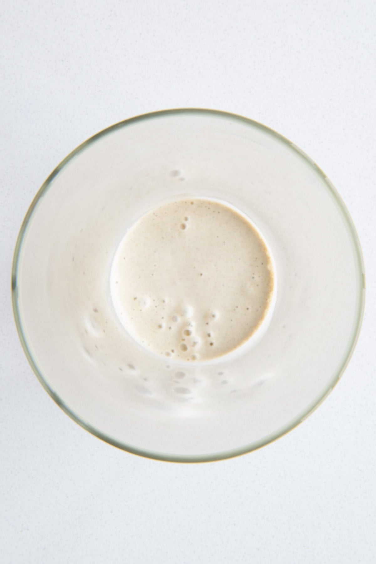Creamy lime miso dressing in a glass salad jar.