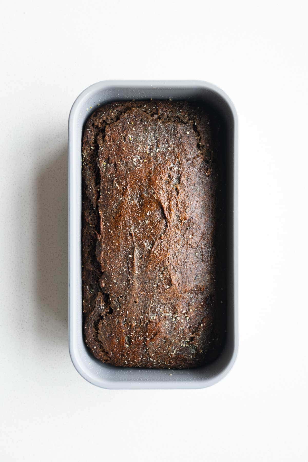 Baked black sesame cake in a loaf pan.