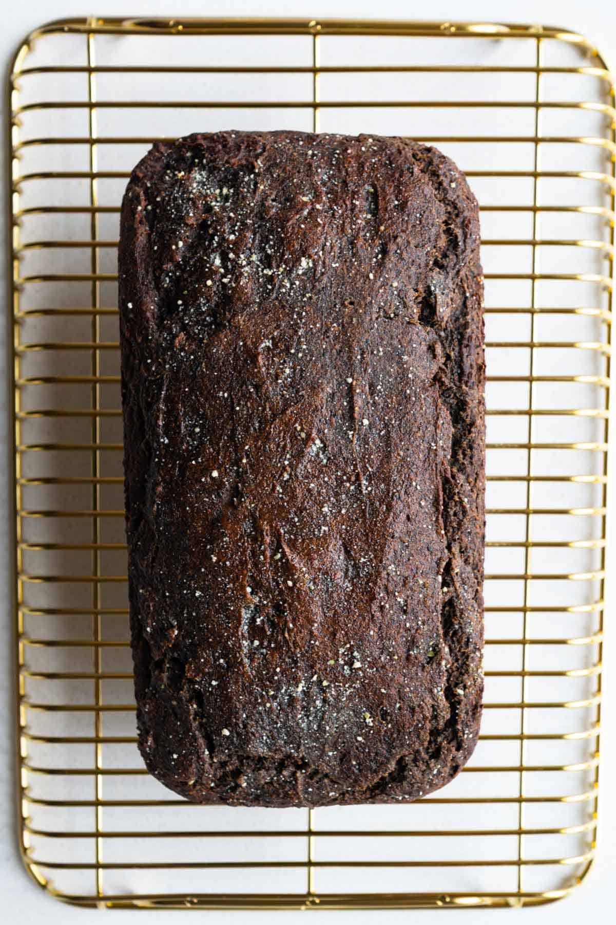 Baked cake on a cooling rack.