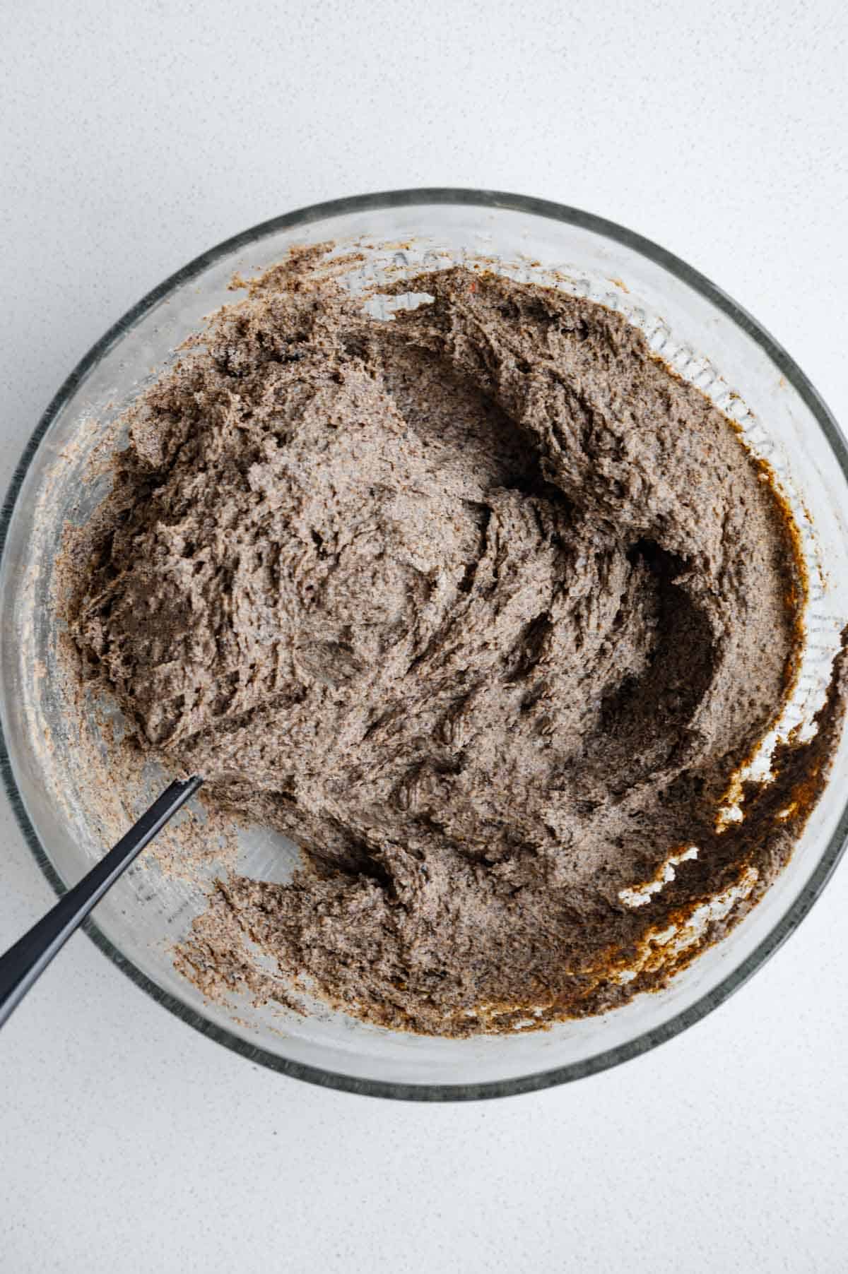 Batter in a bowl with a spoon.