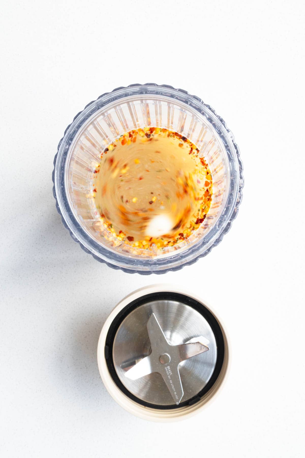 Garlic, crushed red pepper, water, miso, lime juice and zest, cumin, and dates in a blender.