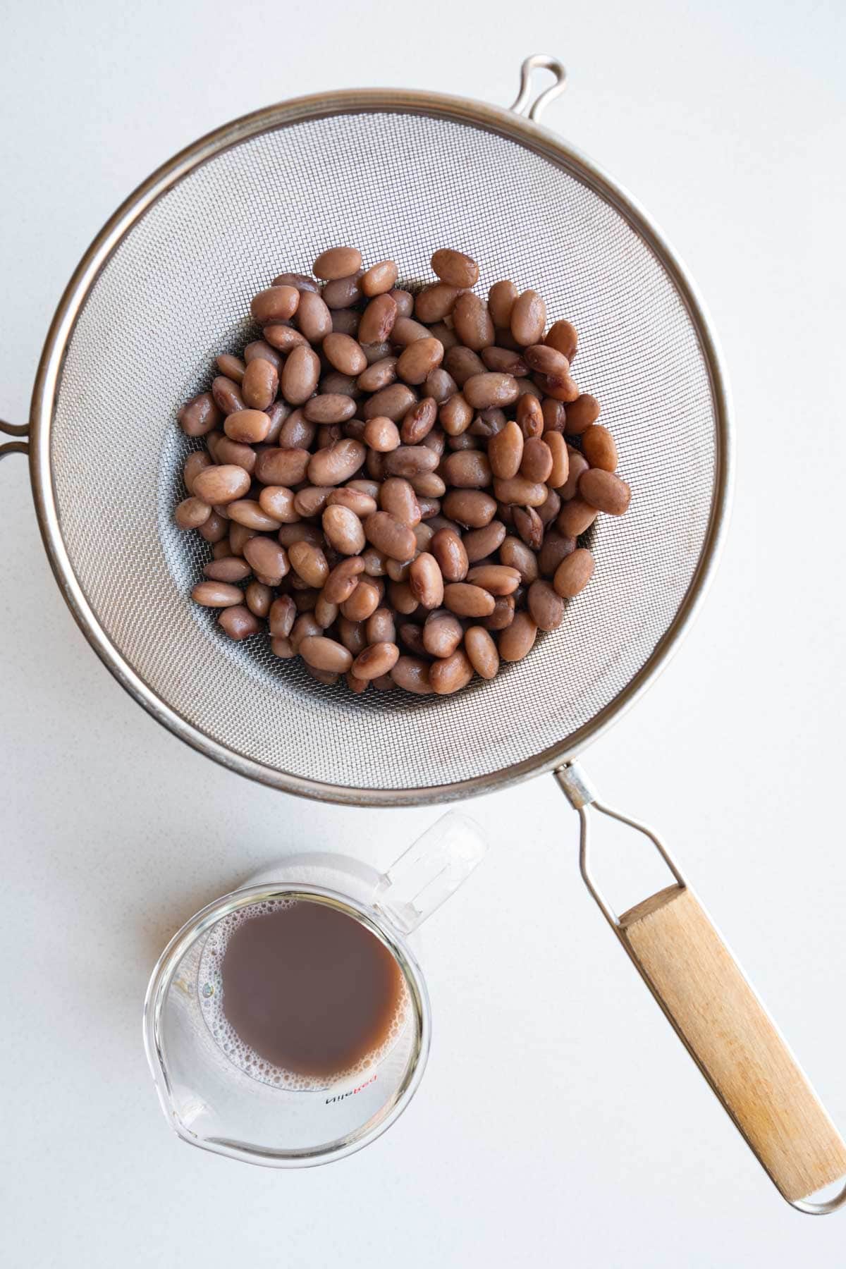 Cooked and drained pinto beans and bean cooking water.