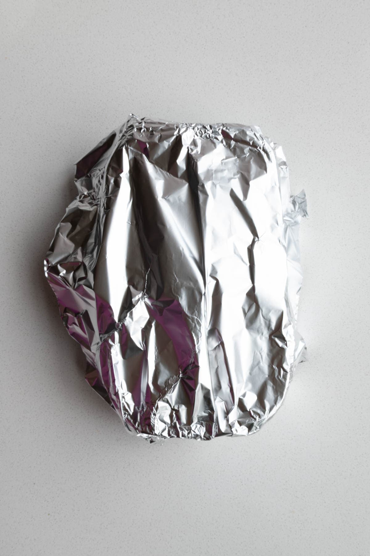 Tented banana bread with aluminum foil.