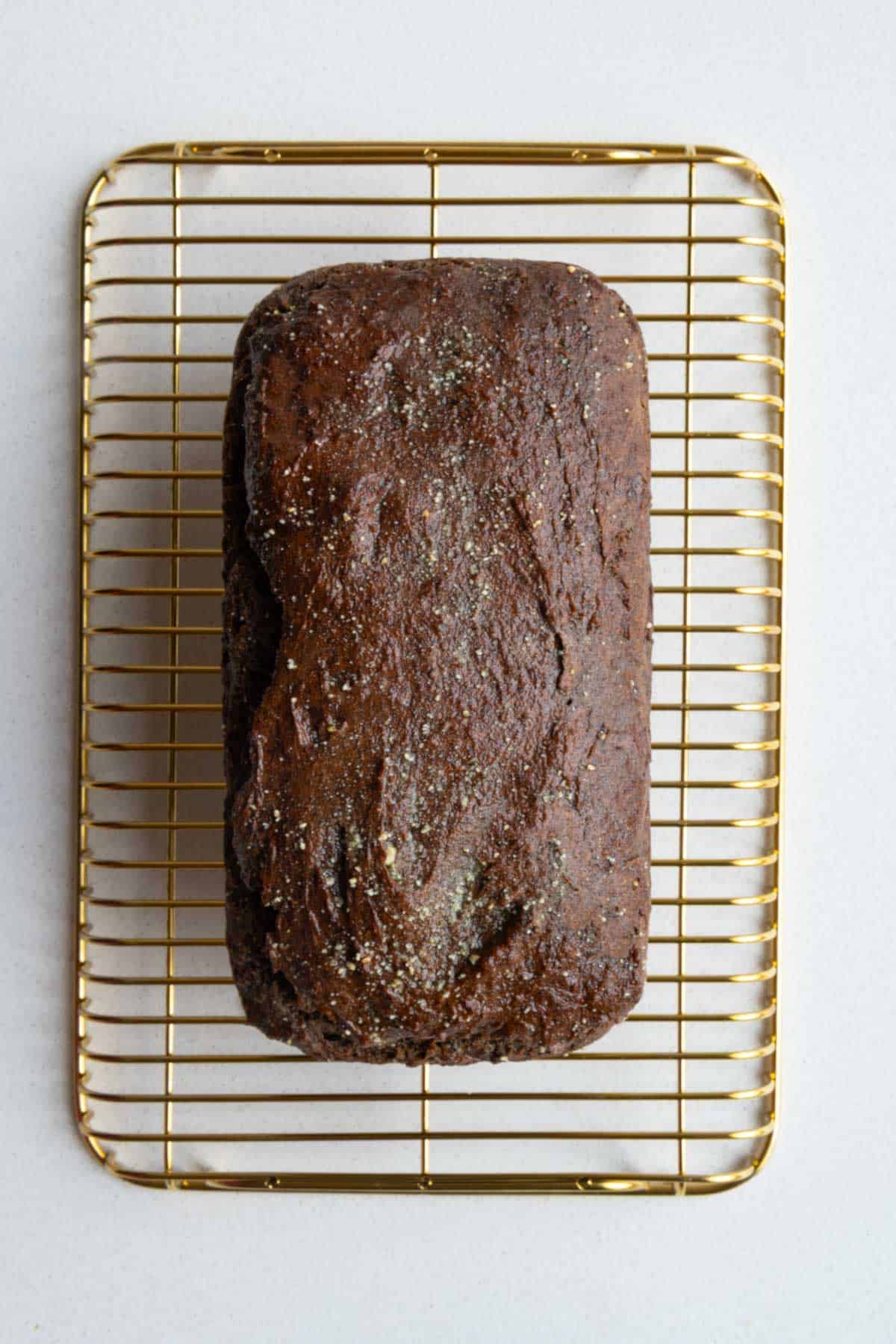 Healthy banana bread on a cooling rack.