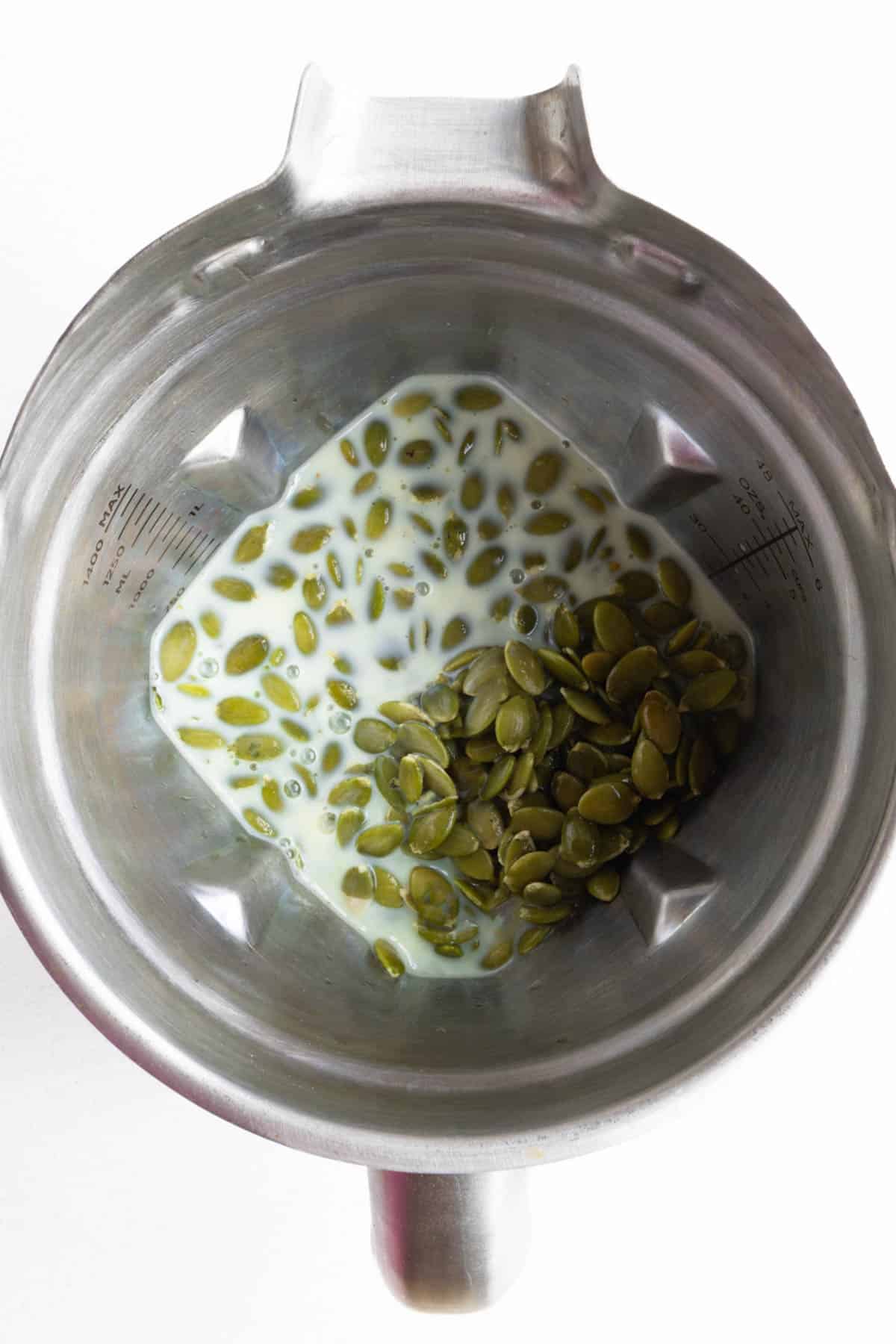 Soaked pumpkin seeds, nondairy milk, mashed bananas, and vanilla extract in a blender.